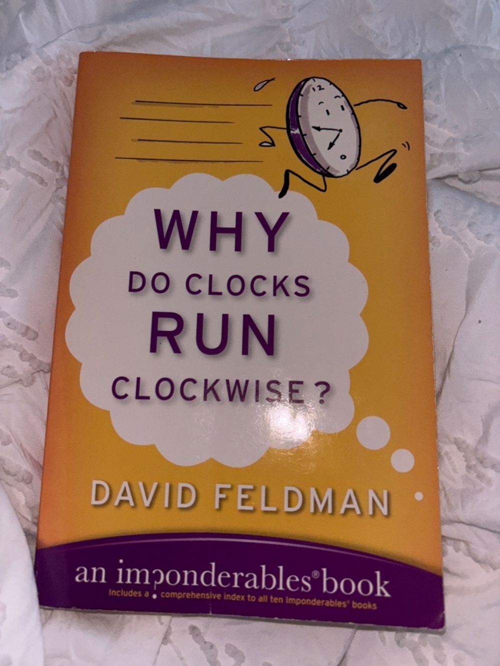 Amazon Yellow and Purple 'Why Do Clocks Run Clockwise?' Notebook
